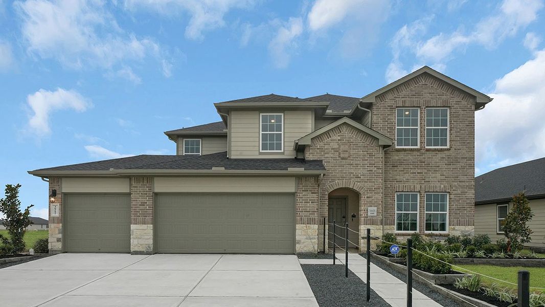 Front exterior of a new home in Evergreen, Rosenberg, TX, highlighting curb appeal (Image 1).