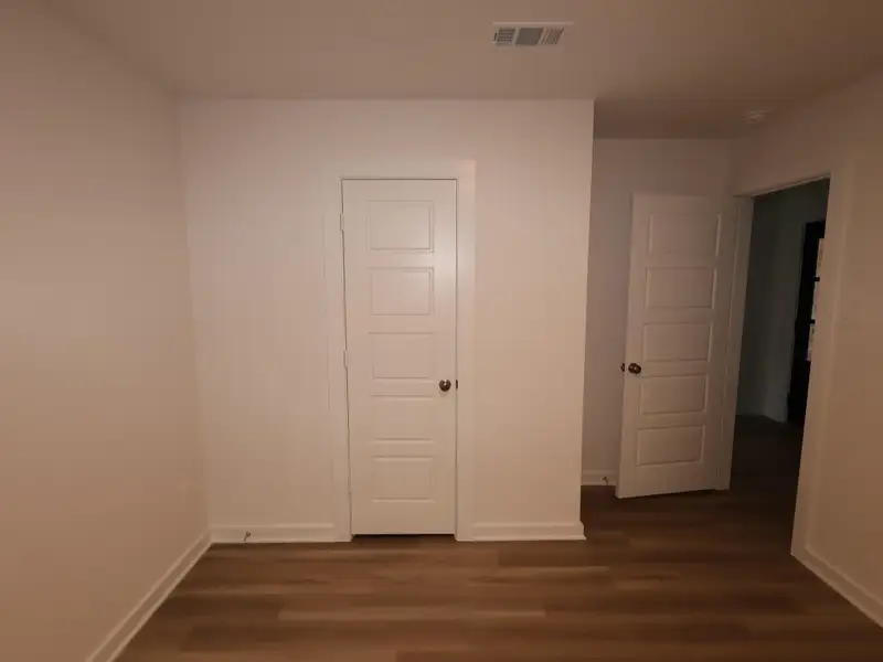 Spacious, unfurnished interior of a new home in Pinewood at Grand Texas, New Caney (Image 9).