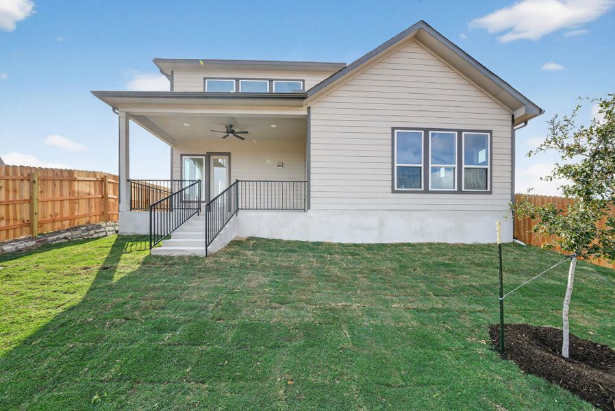 Rear view of house with a ceiling fan, a fenced backyard, and a patio area Rear view of house with a ceiling fan, a fenced backyard, and a patio area