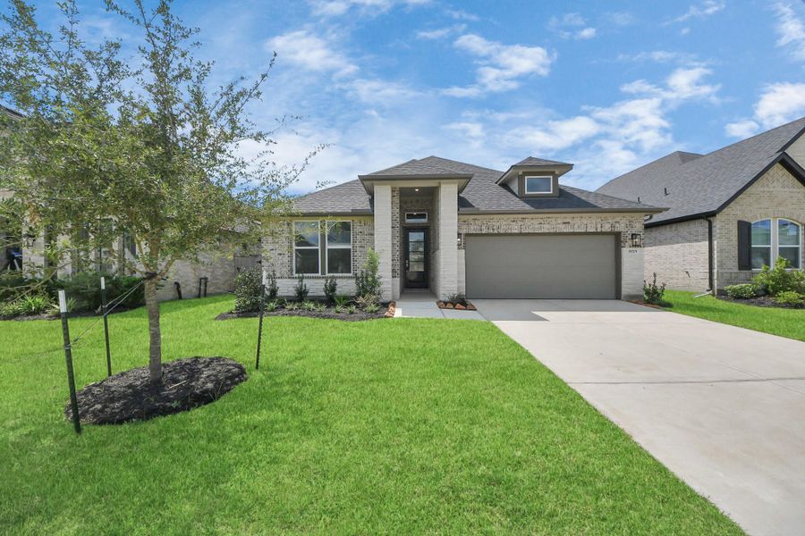 Front exterior of a new home in Amira: Heritage Collection, Tomball, TX, highlighting curb appeal (Image 19). Front exterior of a new home in Amira: Heritage Collection, Tomball, TX, highlighting curb appeal (Image 19).
