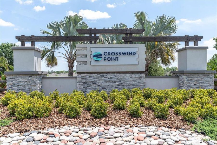 Front exterior of a new home in Crosswind Point, Parrish, FL, highlighting curb appeal (Image 1).