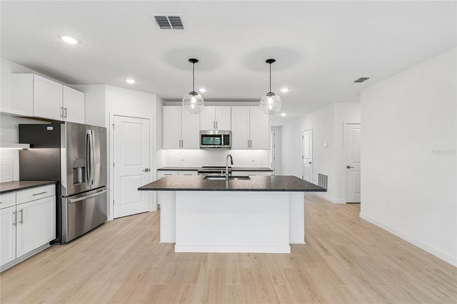 Furnished interior view inside a new home in Aspire at Canter Creek, Davenport (Image 5).