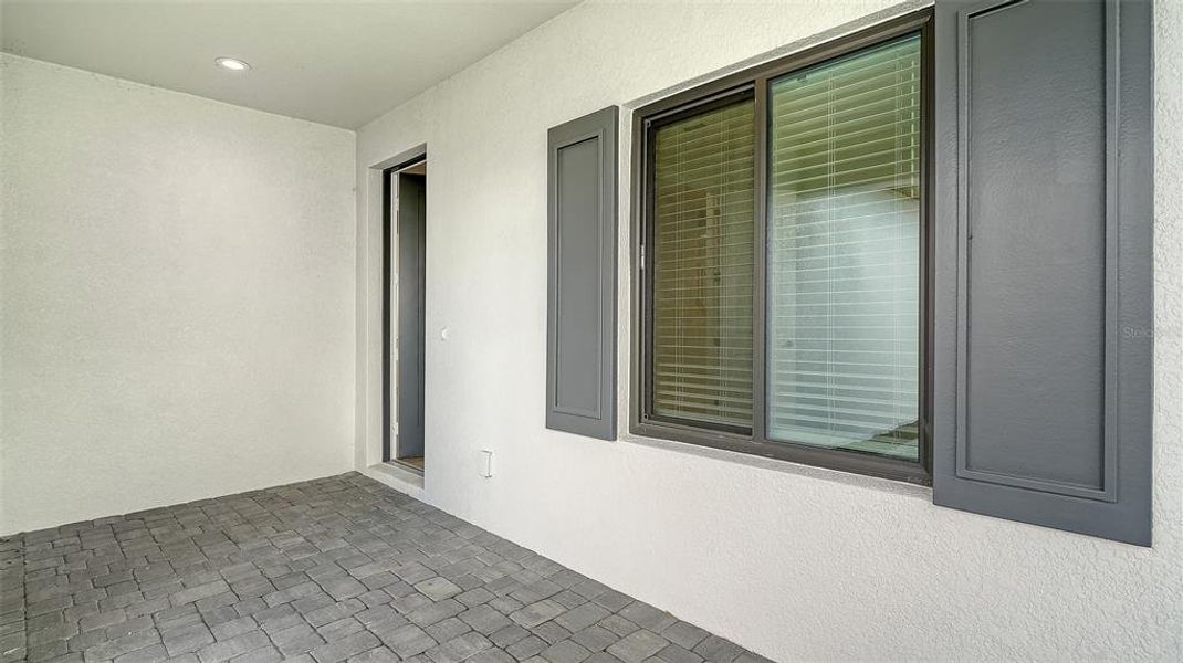 Exterior details and patio area of a home in Palm Grove, Lakewood Ranch (Image 28).