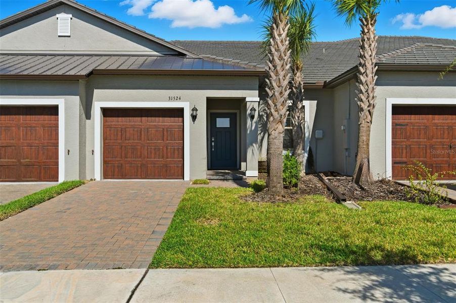 Front exterior of a new home in Mirada Active Adult: Active Adult Villas, San Antonio, FL, highlighting curb appeal (Image 1). Front exterior of a new home in Mirada Active Adult: Active Adult Villas, San Antonio, FL, highlighting curb appeal (Image 1).