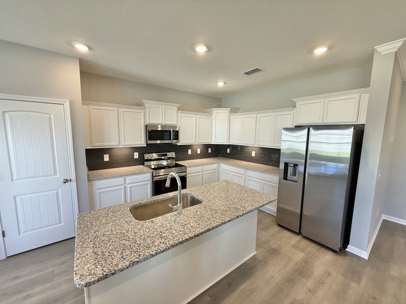 Furnished interior view inside a new home in Stone Fort Meadows, Manchester (Image 4).