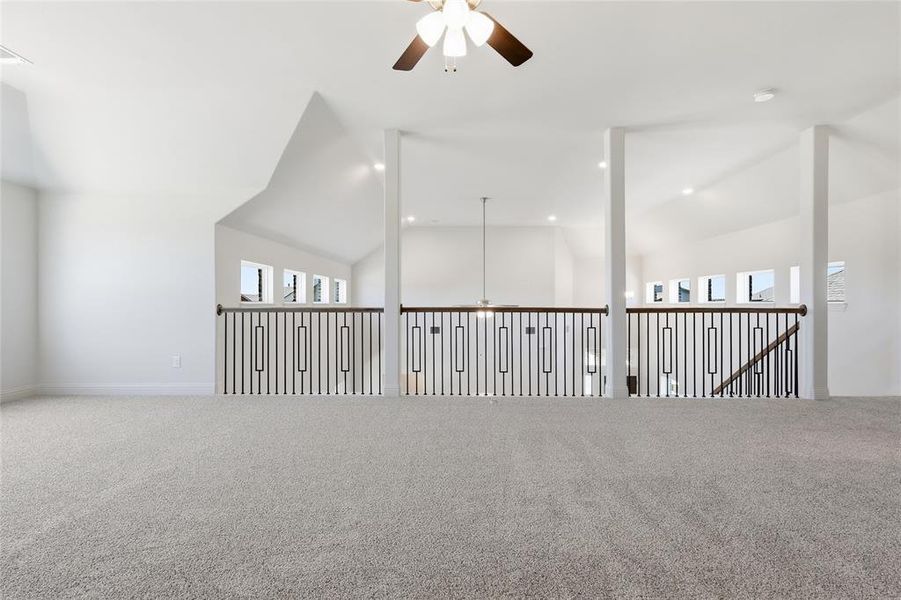 Unfurnished room with a ceiling fan, vaulted ceiling, carpet, and recessed lighting