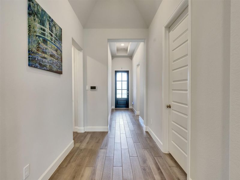 Inviting hallway featuring a bright and welcoming entryway.