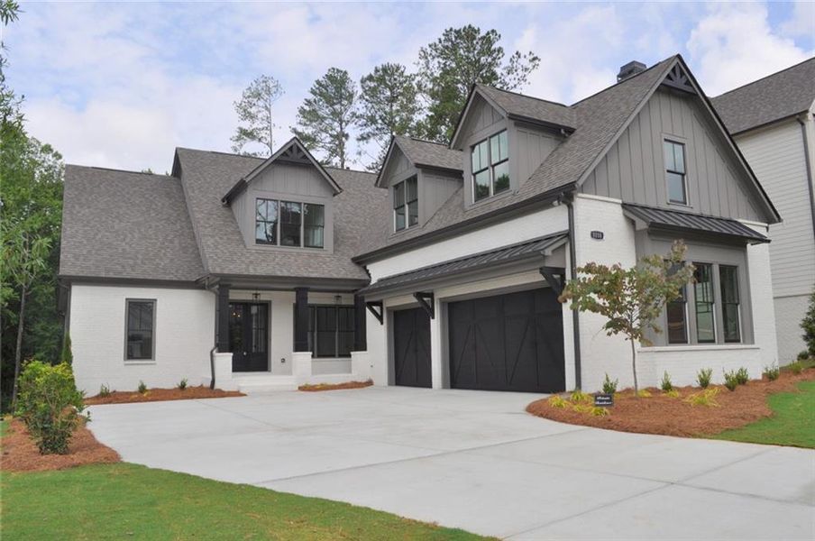 Front exterior of a new home in Woodford, Acworth, GA, highlighting curb appeal (Image 2).