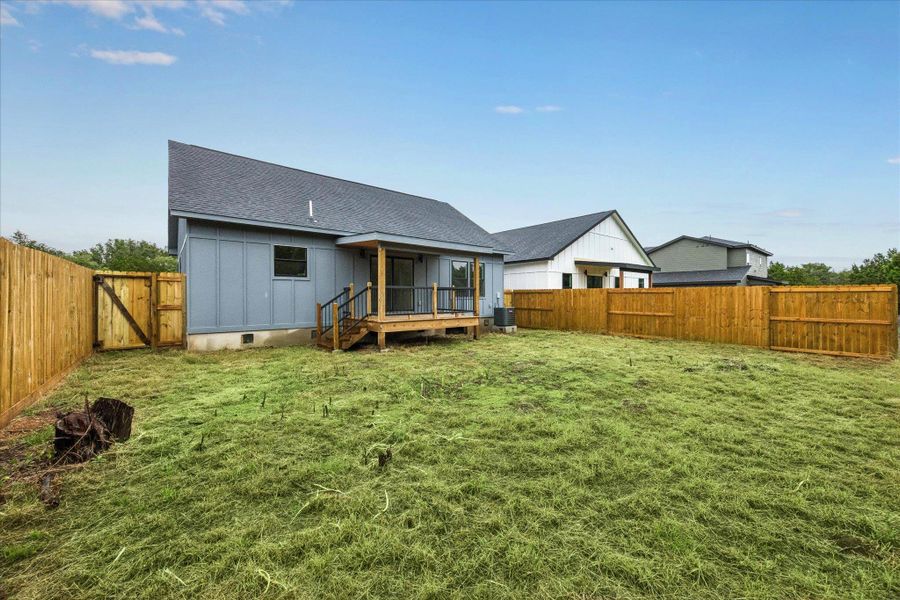A spacious backyard with new wooden fencing offers a private retreat for outdoor enjoyment. A spacious backyard with new wooden fencing offers a private retreat for outdoor enjoyment.