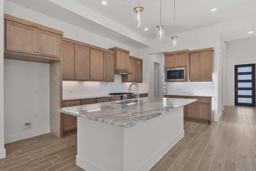 Representative furnished interior of a home built from the Sorenstam by Chesmar Homes in Riceland Alley Loads, Mont Belvieu (Image 5).