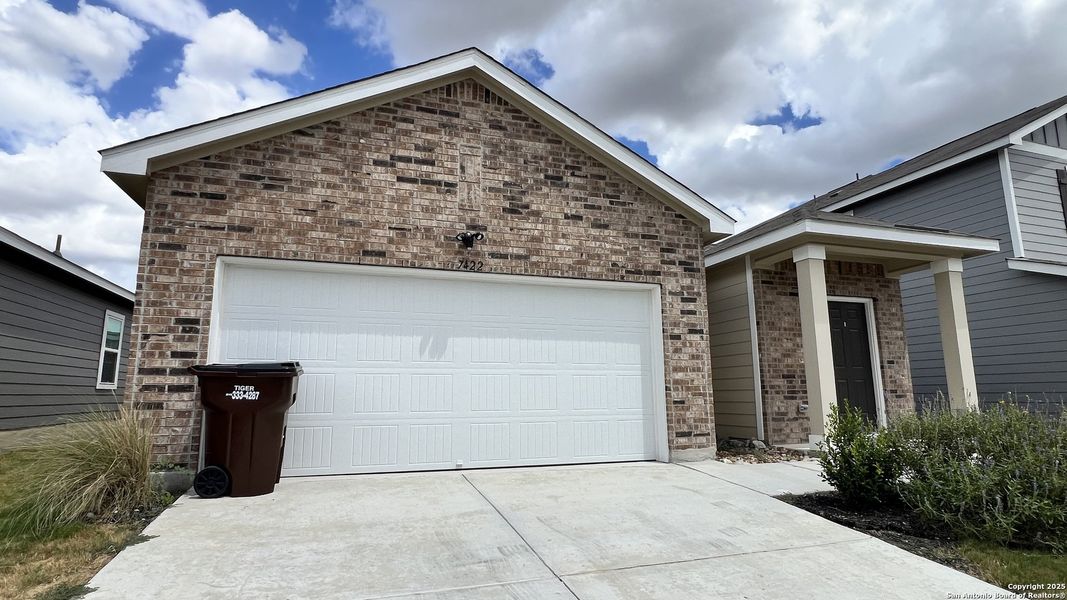 Front exterior of a new home in Trails at Culebra, San Antonio, TX, highlighting curb appeal (Image 17).