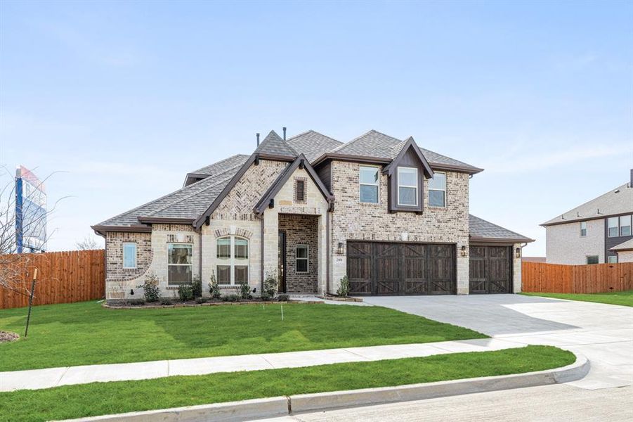 Front exterior of a new home in Triple Diamond Ranch, Mansfield, TX, highlighting curb appeal (Image 2).