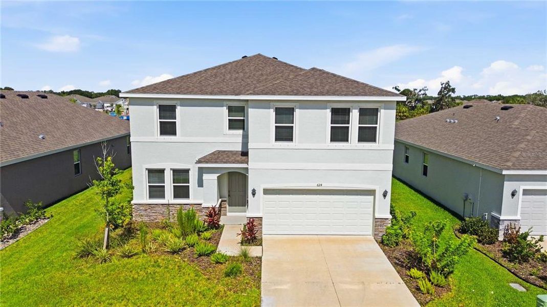 Front exterior of a new home in Coddington, Bradenton, FL, highlighting curb appeal (Image 28).