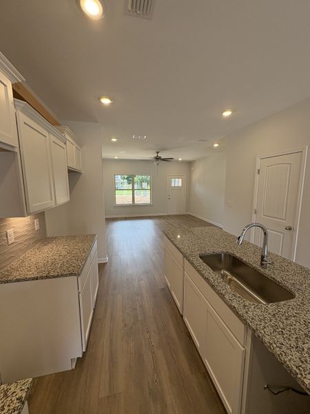 Photo is of the model home to show what the completed floor plan looks like. Selections and Options may vary. ALL STAINLESS STEEL KITCHEN APPLIANCES WILL BE INCLUDED