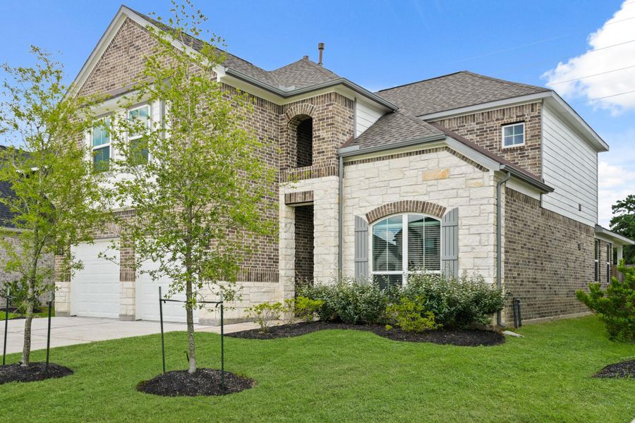 Front exterior of a new home in Grand Oaks – The Cove, Houston, TX, highlighting curb appeal (Image 1).