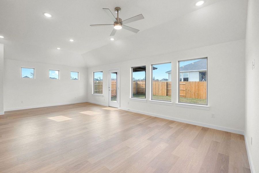 Living and Dining in the Sabine home plan by Trophy Signature Homes – REPRESENTATIVE PHOTO