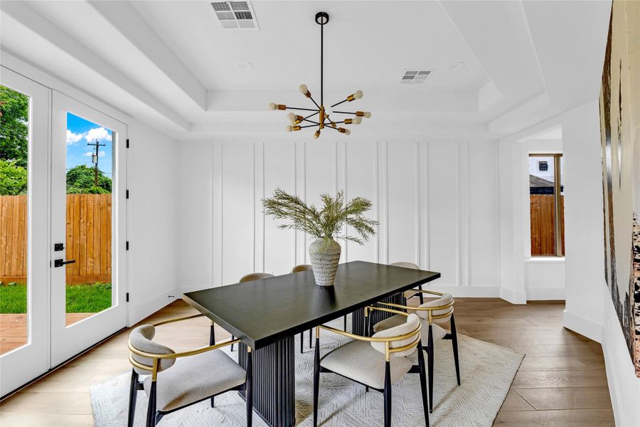 Elegant ceiling and wall details add character and charm.