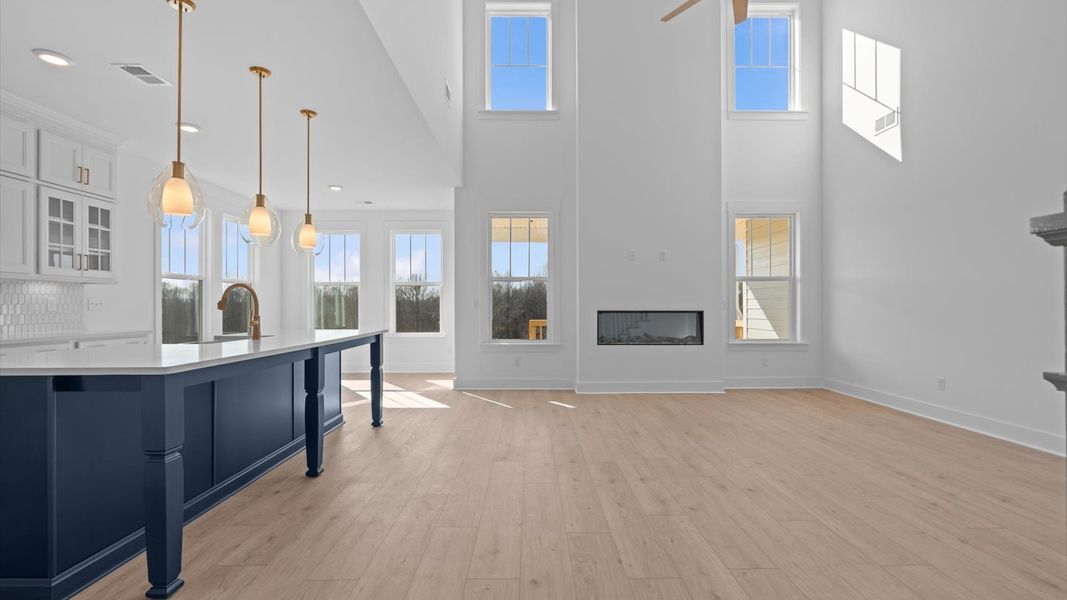 Exceptional family space featuring two-story ceilings, hardwood flooring, and tasteful finishes throughout