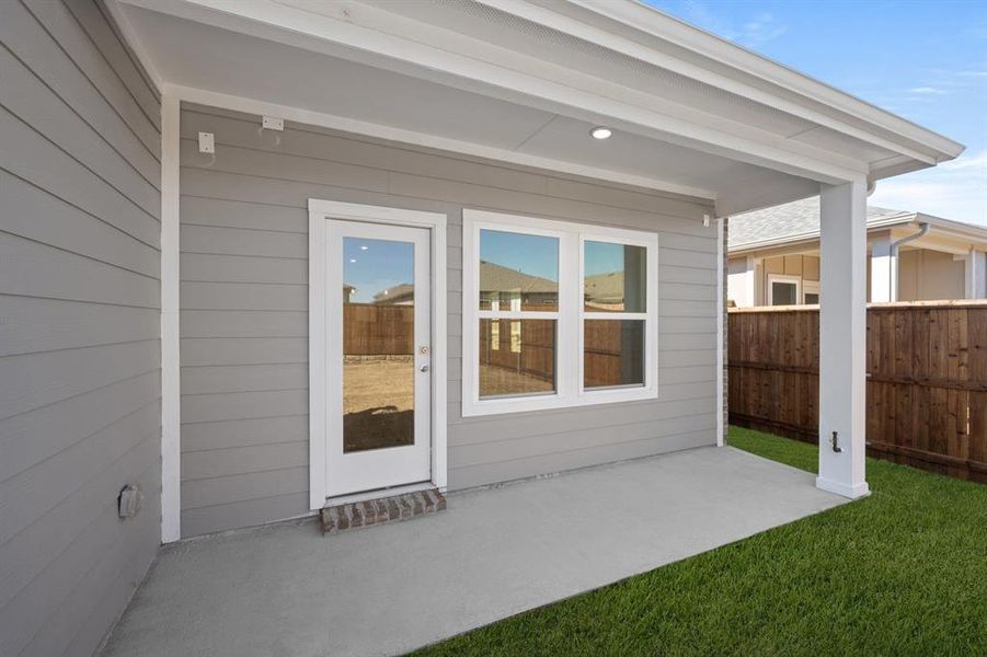 Exterior details and patio area of a home in The Meadows, Krum (Image 4).
