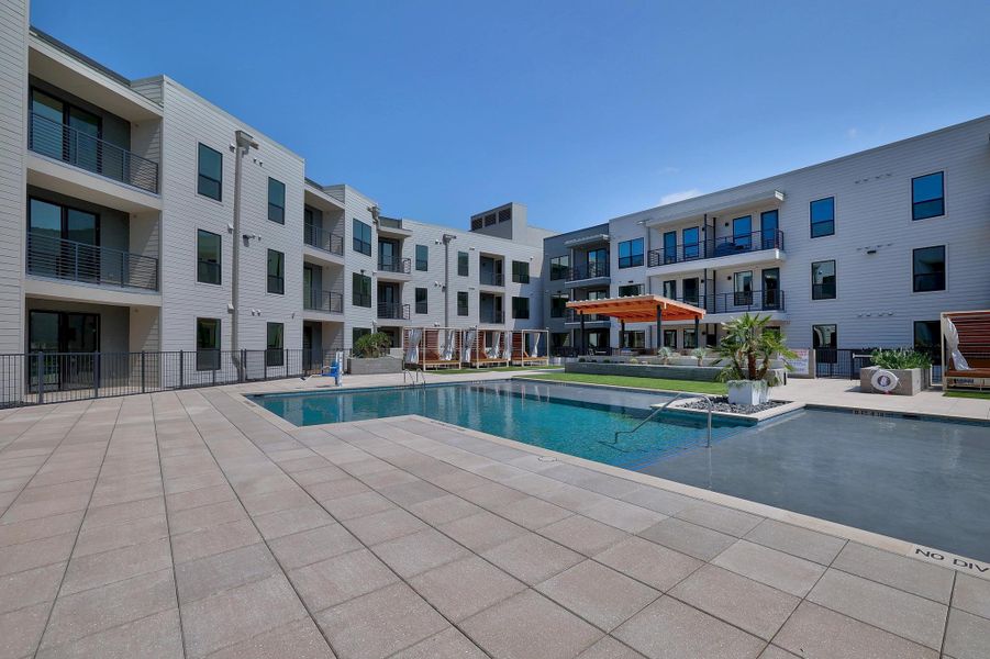 Community pool with cabanas & grills Community pool with cabanas & grills