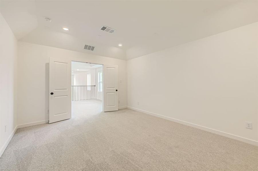 Unfurnished room with light colored carpet, baseboards, and recessed lighting Unfurnished room with light colored carpet, baseboards, and recessed lighting