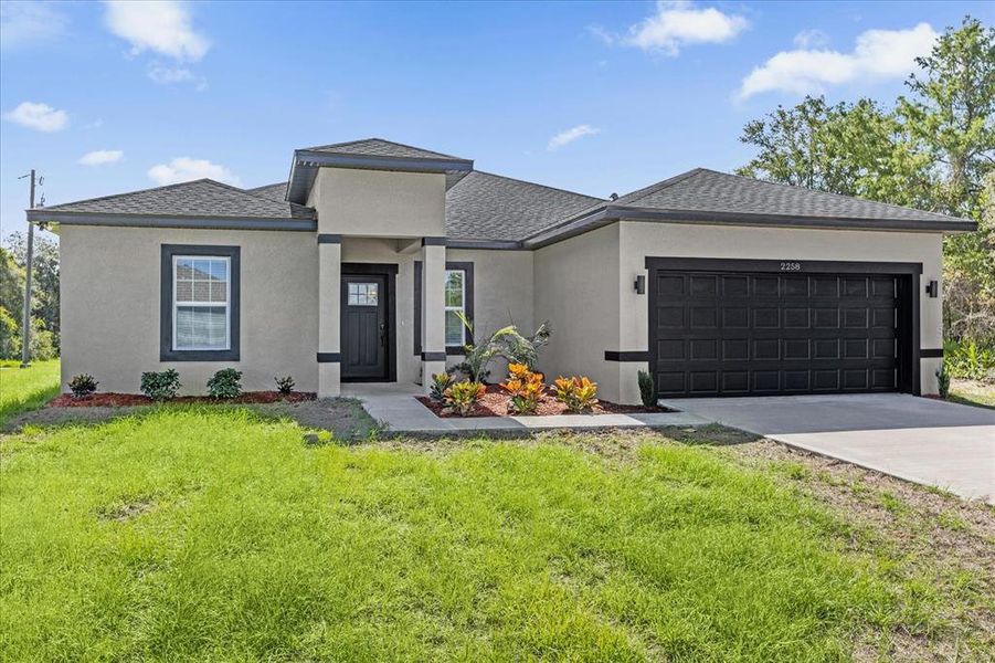 Front exterior of a new home in , Ocala, FL, highlighting curb appeal (Image 2).