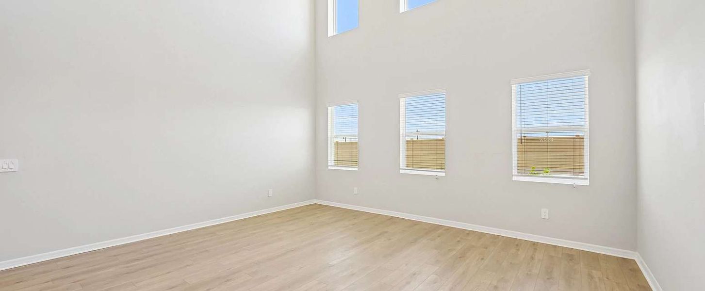 Two-story great room features six large windows for optimal lighting - Representative images and renderings are for illustrative purposes Two-story great room features six large windows for optimal lighting - Representative images and renderings are for illustrative purposes