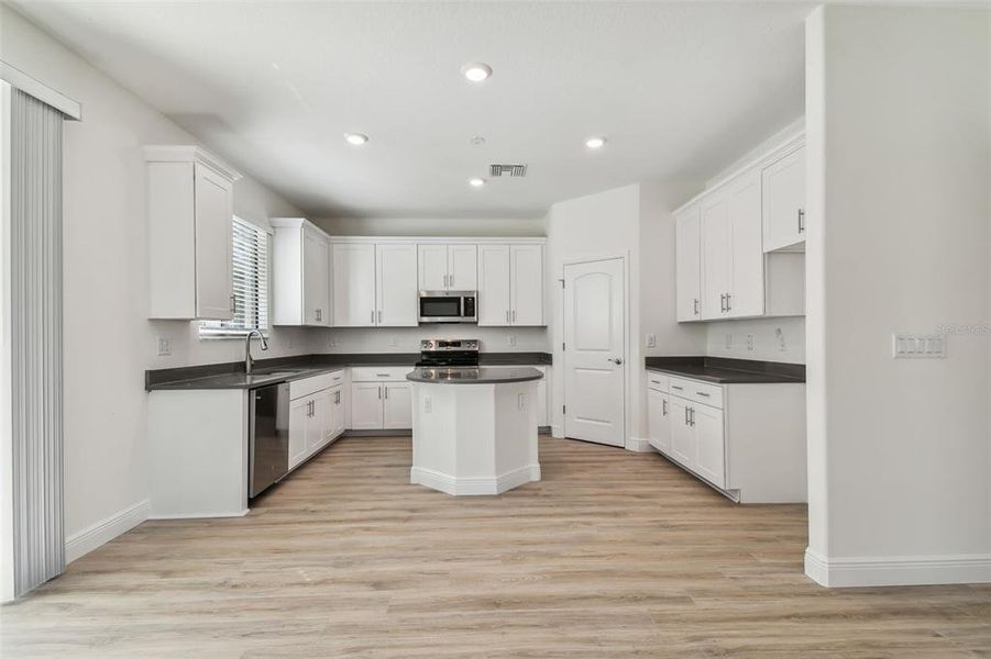 Photos are not the home listed, but same floor plan.