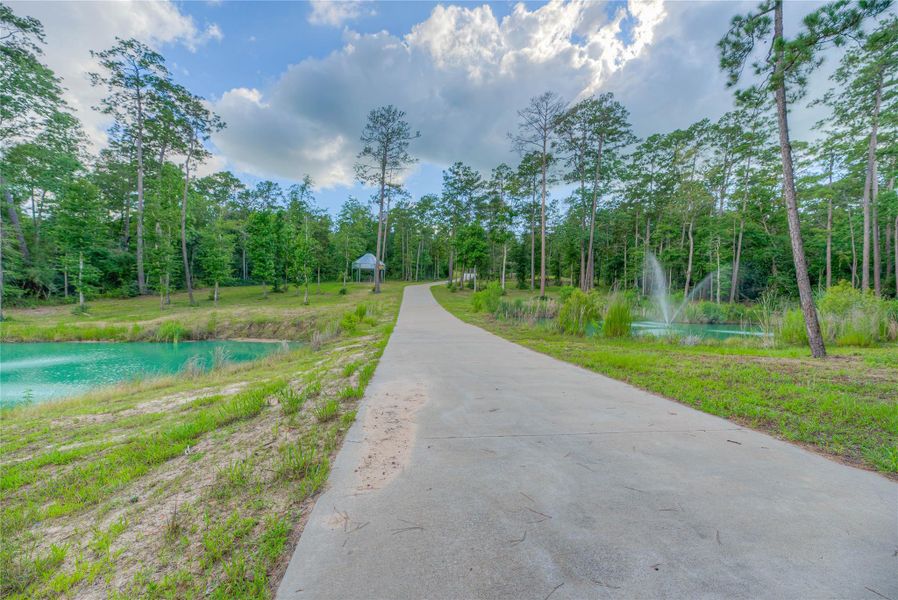 Concrete driveway leading up to the 8,200 sqft building with 2 ponds Concrete driveway leading up to the 8,200 sqft building with 2 ponds