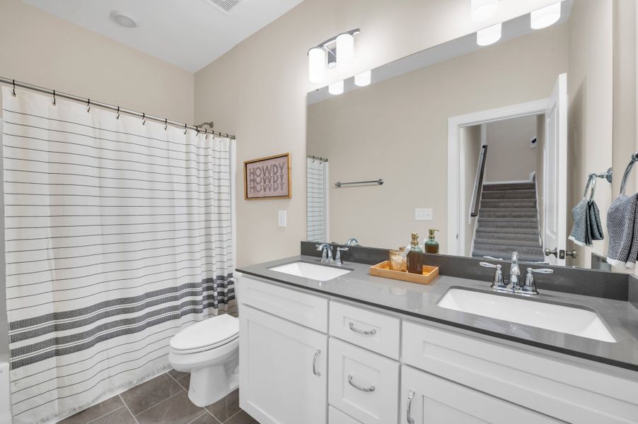 Representative furnished interior of a home built from the The Amherst by RobuckHomes in Windwater, Hampstead (Image 43).