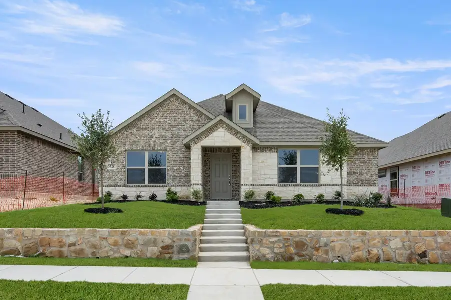 Front exterior of a new home in Redden Farms, Midlothian, TX, highlighting curb appeal (Image 1). Front exterior of a new home in Redden Farms, Midlothian, TX, highlighting curb appeal (Image 1).