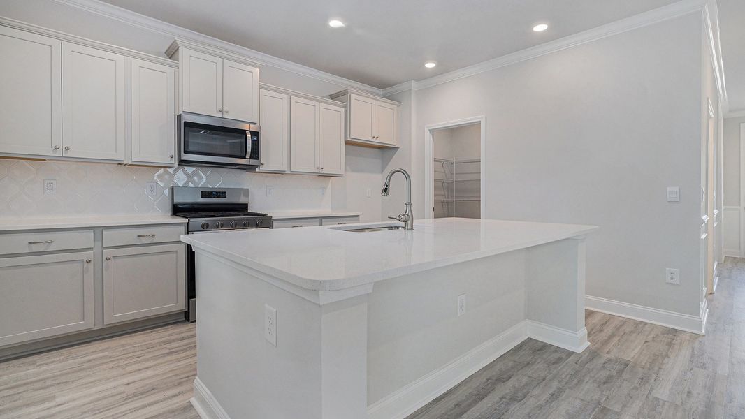 Representative furnished interior of a home built from the GLYNN by D.R. Horton in The Forest at Black Bear, Longs (Image 5).