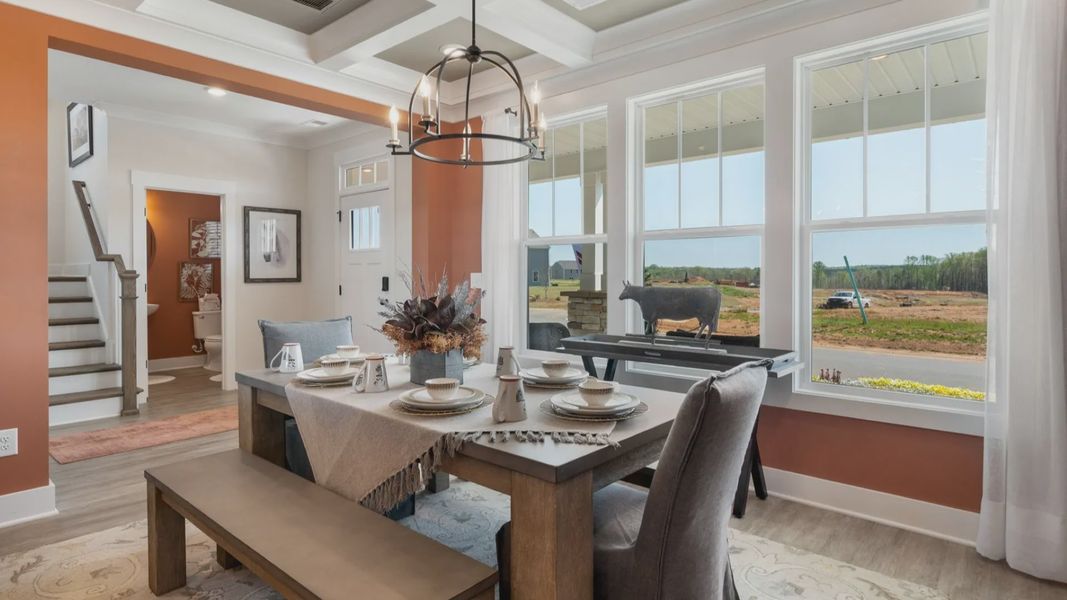 Exclusive dining area with coffered ceiling and refined finishes in a reputable Woodruff, SC location