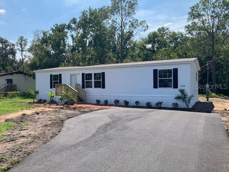 Front exterior of a new home in , Wesley Chapel, FL, highlighting curb appeal (Image 10).