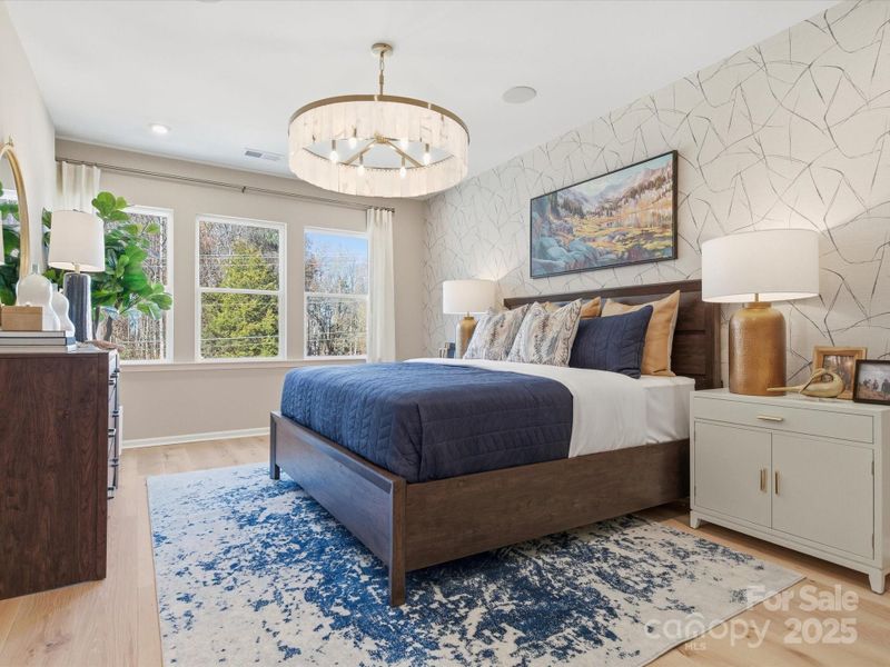 Primary Suite with Wall of Windows. *Model Photos | Actual Finishes, Structural Selections, and Orientation May Vary.