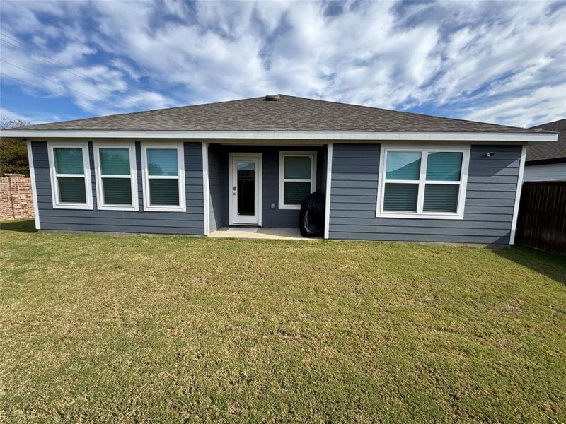 View of front of property featuring a front lawn