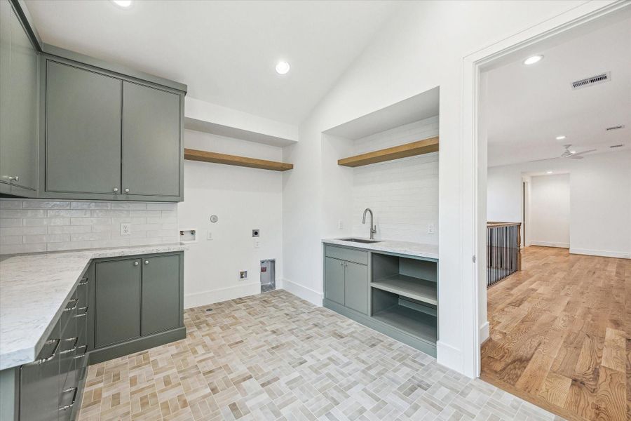 Another view of upstairs utility with white oak floating shelves and abundance of storage and counters! Another view of upstairs utility with white oak floating shelves and abundance of storage and counters!