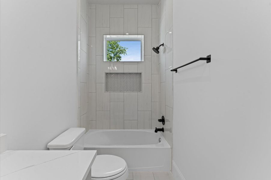 Bath for secondary bedroom. *Previous Brownstone Living project, selections and floor plans may vary.*