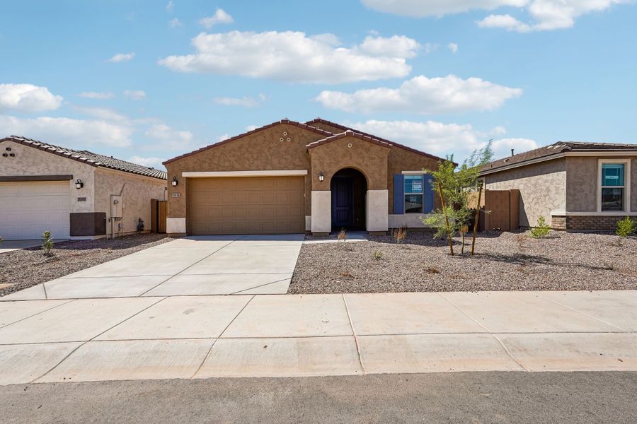 Front exterior of a new home in Hawes Crossing, Mesa, AZ, highlighting curb appeal (Image 24).
