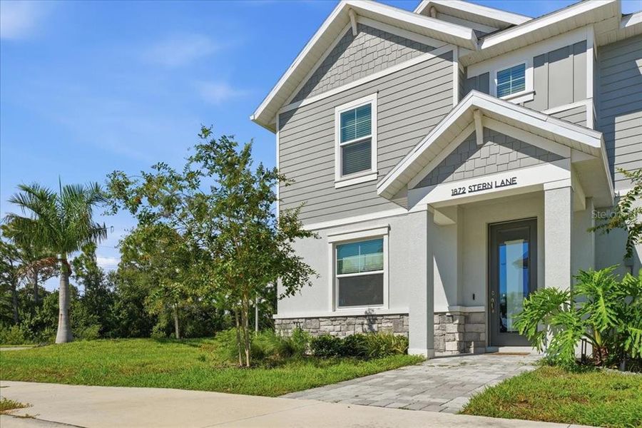 Front exterior of a new home in , Sarasota, FL, highlighting curb appeal (Image 26).