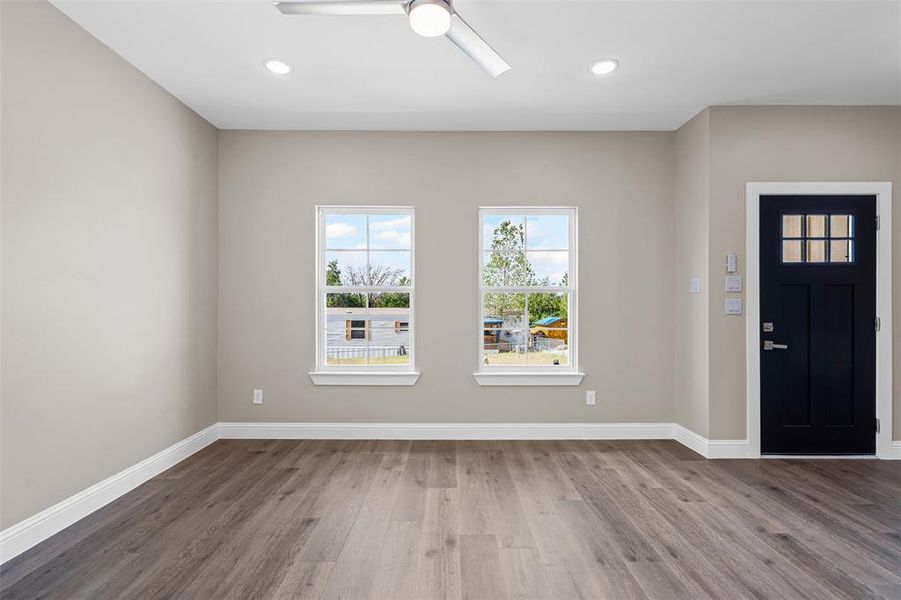 Entryway featuring wood finished floors, recessed lighting, and a ceiling fan Entryway featuring wood finished floors, recessed lighting, and a ceiling fan