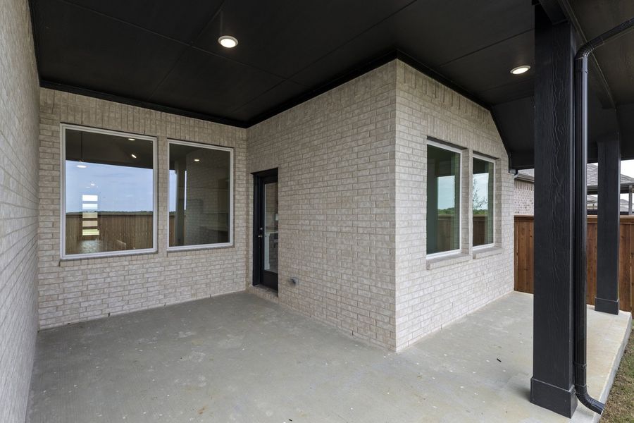 Exterior details and patio area of a home in Creekview Meadows, Pilot Point (Image 3).