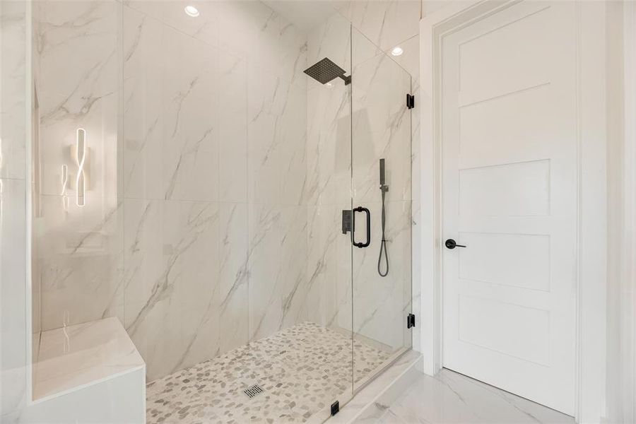 Bathroom featuring a marble finish shower Bathroom featuring a marble finish shower