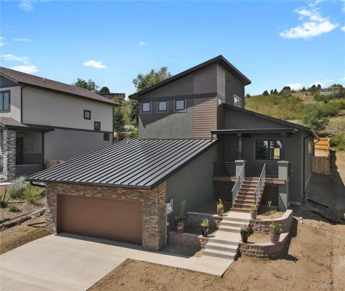Front exterior of a new home in , Colorado Springs, CO, highlighting curb appeal (Image 28). Front exterior of a new home in , Colorado Springs, CO, highlighting curb appeal (Image 28).