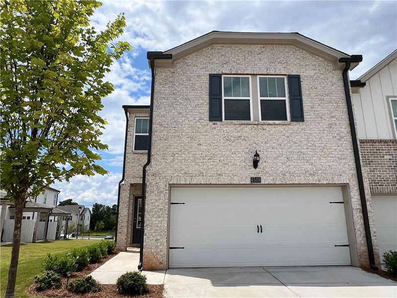 Front exterior of a new home in , Lawrenceville, GA, highlighting curb appeal (Image 22).