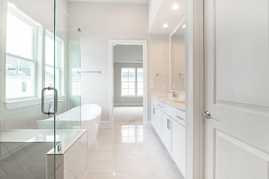 The primary bath is your own spa retreat.
