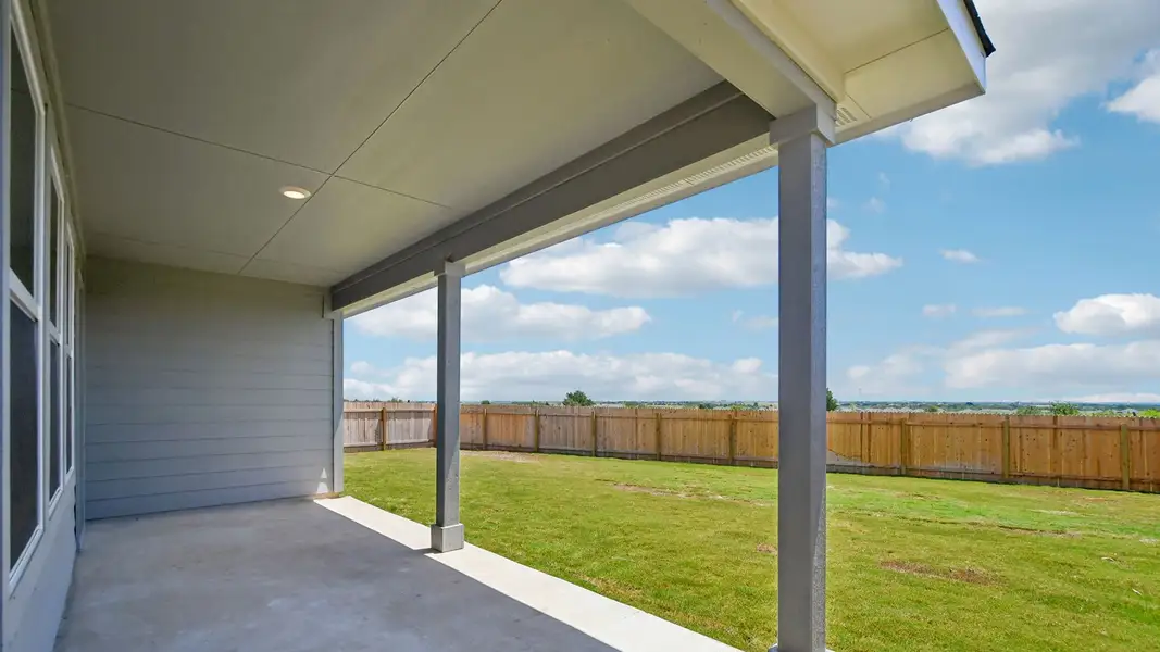 Exterior details and patio area of a home in Carillon, Manor (Image 4).