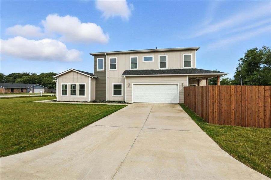 Front exterior of a new home in , Roanoke, TX, highlighting curb appeal (Image 2).