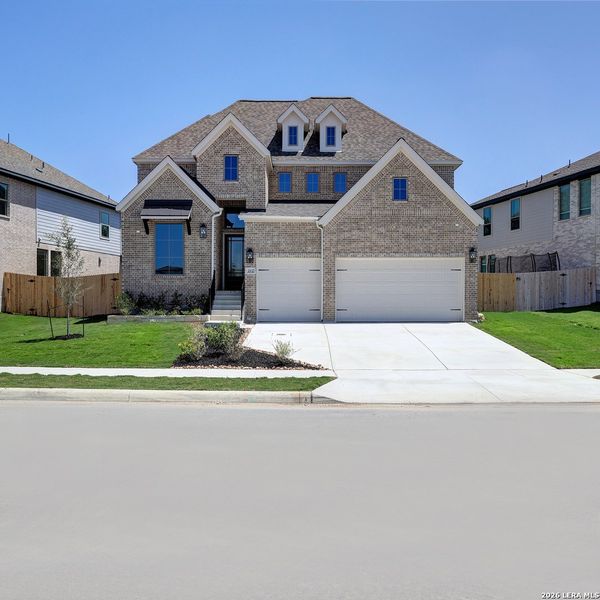 Front exterior of a new home in The Ranches at Creekside, Boerne, TX, highlighting curb appeal (Image 2). Front exterior of a new home in The Ranches at Creekside, Boerne, TX, highlighting curb appeal (Image 2).