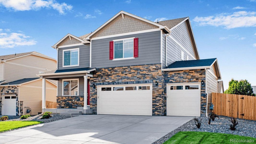 Front exterior of a new home in Trails at Crowfoot, Parker, CO, highlighting curb appeal (Image 2).